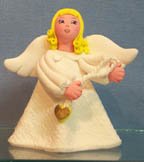 Angel - stands holding heart on cord