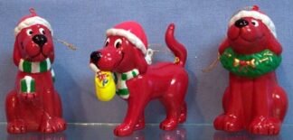 Clifford - Gift sits holding gift in his paw