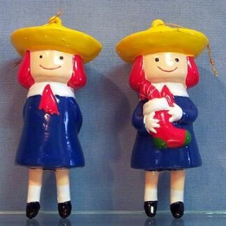 Madeline - stands holding gift behind her back